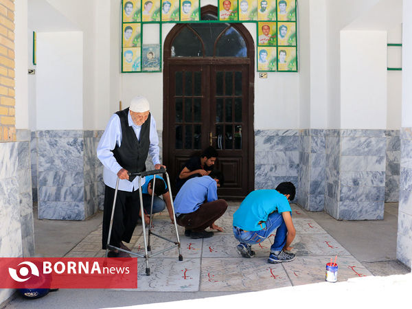 رنگ آمیزی مزار شهدا در آرامستان خواجه ربیع مشهد