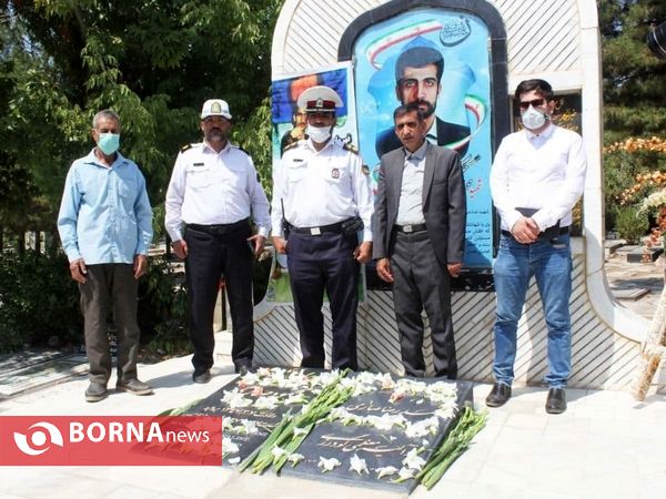 عطر افشانی مزار خبرنگارشهید محمود صارمی دربروجرد