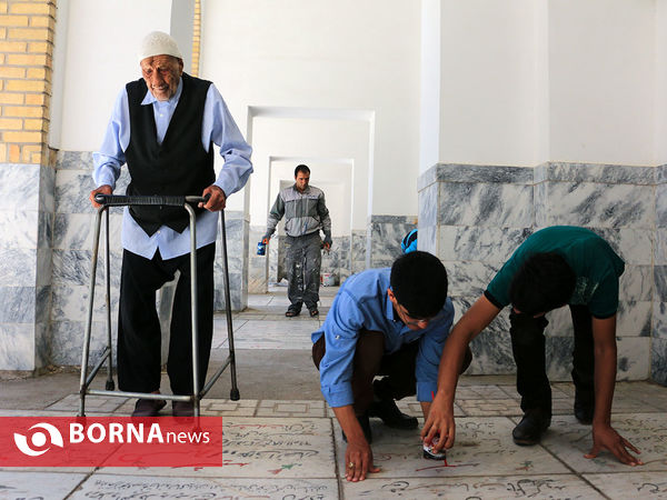 رنگ آمیزی مزار شهدا در آرامستان خواجه ربیع مشهد